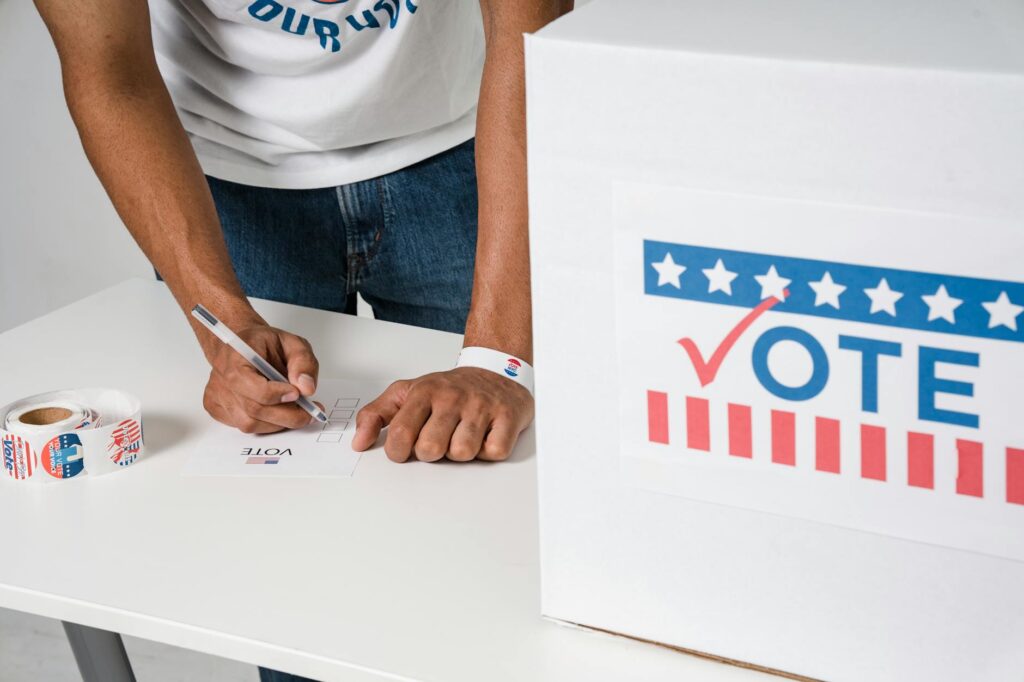 A checklist graphic for documents needed for in-person voter registration. — how to register to vote Nevada 2026