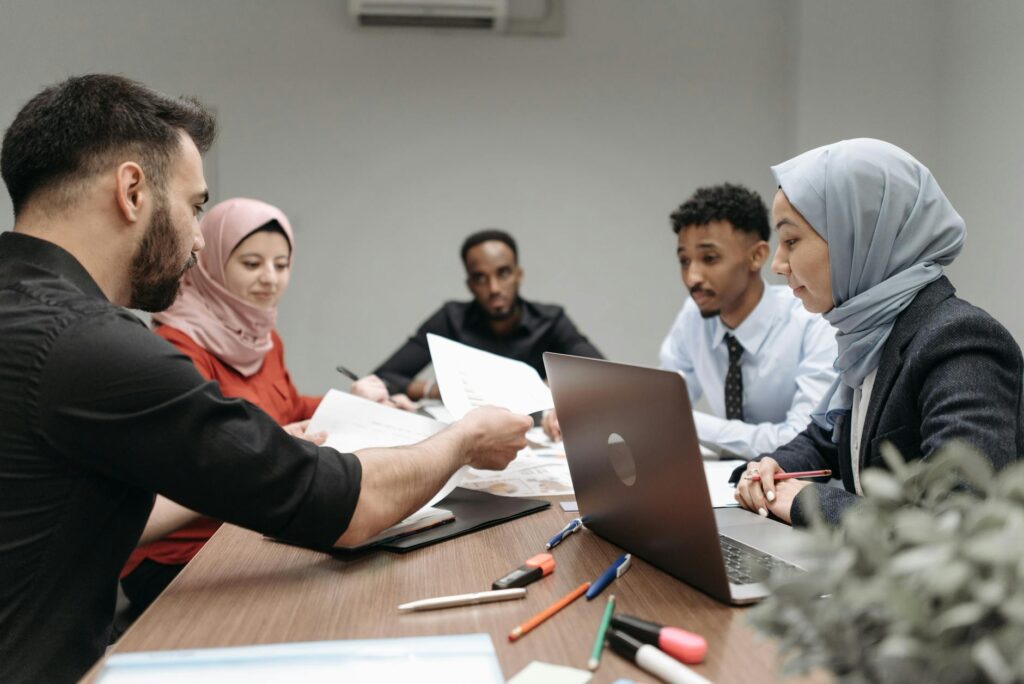 A group meeting of small business owners discussing shared solar solutions. — community solar programs Nevada small busi…