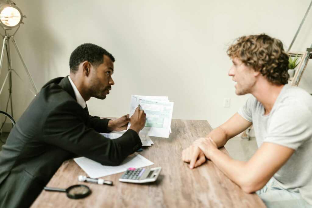 A homeowner reviewing energy incentives paperwork with a financial advisor. — Nevada energy incentives for homeowners