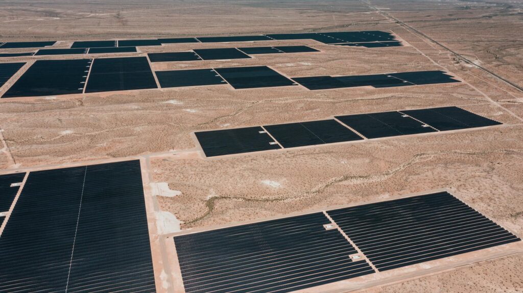 A photo of solar panels in a Nevada desert landscape, showcasing the state's investment in clean energy. — Nevada public…