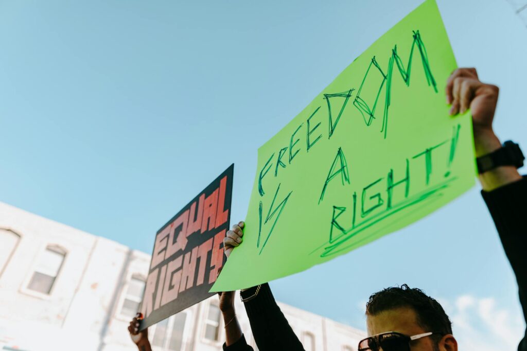 A rally for clean energy advocacy in Nevada with participants holding signs. — advocate clean energy Nevada