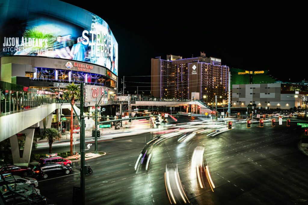 A view of the Las Vegas Strip at night, showcasing the bright lights and energy demands of tourism. — energy shortages t…