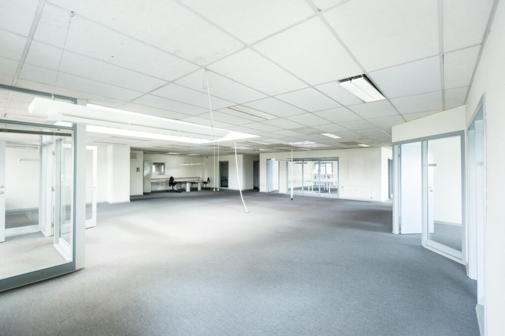 Before and after images of a renovated office space using energy-efficient lighting. — reduce energy costs Nevada small …