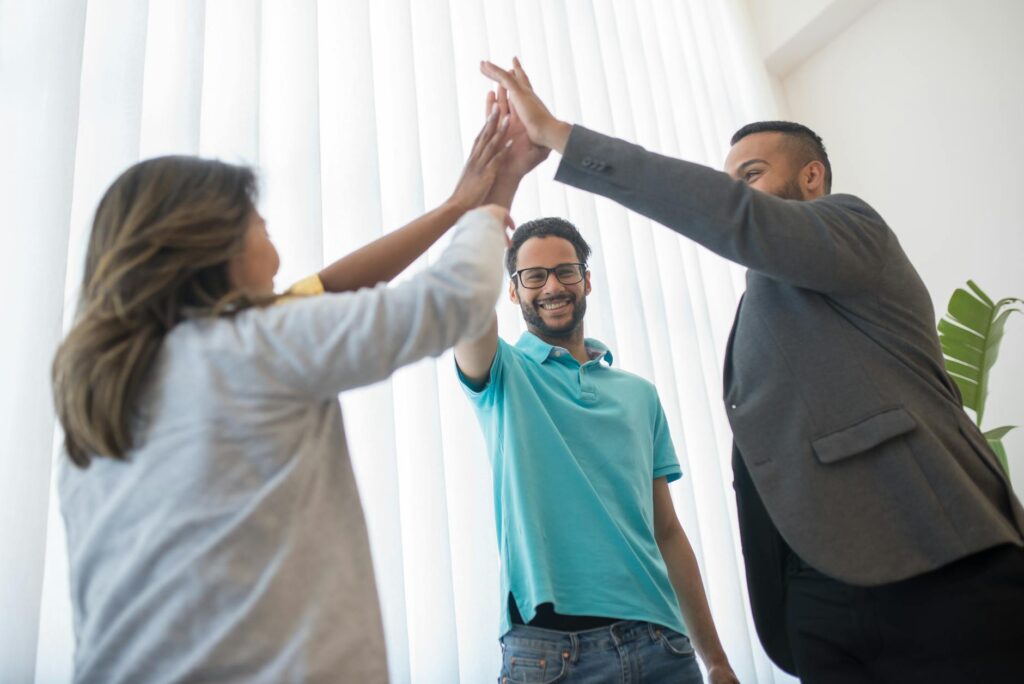 Employees celebrating after completing an energy efficiency training program. — train employees energy efficiency Nevada