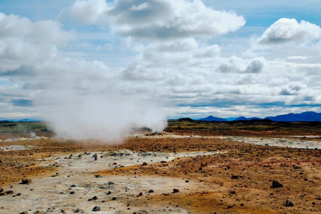 Geothermal power plant with steam rising from the ground in Nevada. — Nevada energy mix