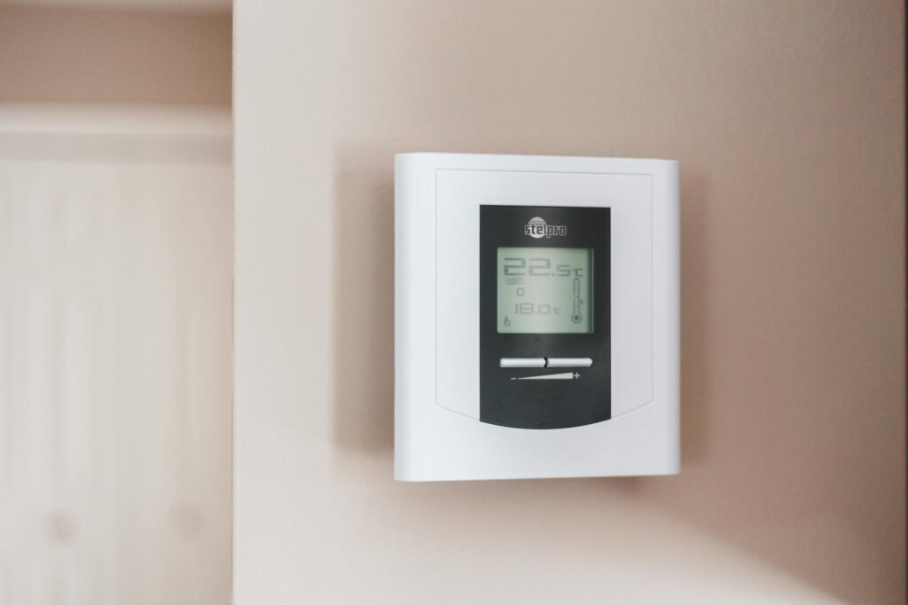 Image of a smart thermostat installed in a Nevada small business, showcasing its energy-saving features — energy-saving …