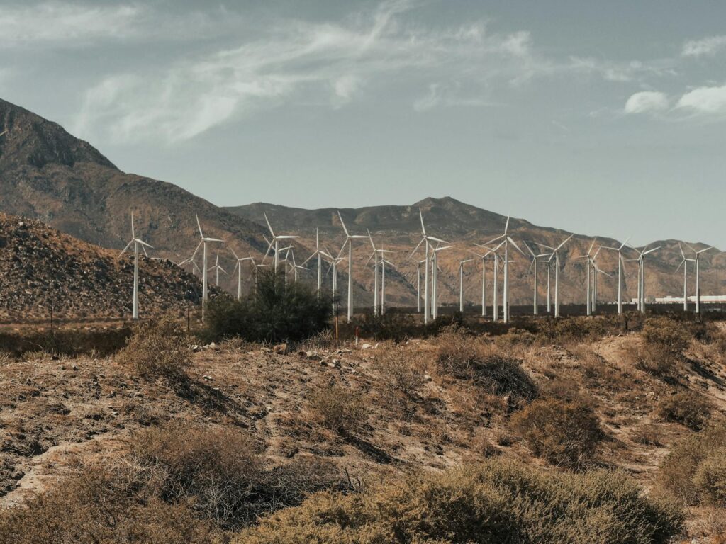 Wind turbines operating in a Nevada landscape to illustrate renewable energy. — Nevada energy sector strategies