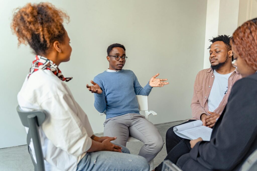 A group of advocates discussing healthcare policies in a community meeting. — Paul For Nevada healthcare