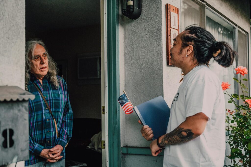 A portrait of Paul For Nevada engaging with local residents about climate change. — Paul For Nevada climate change policy