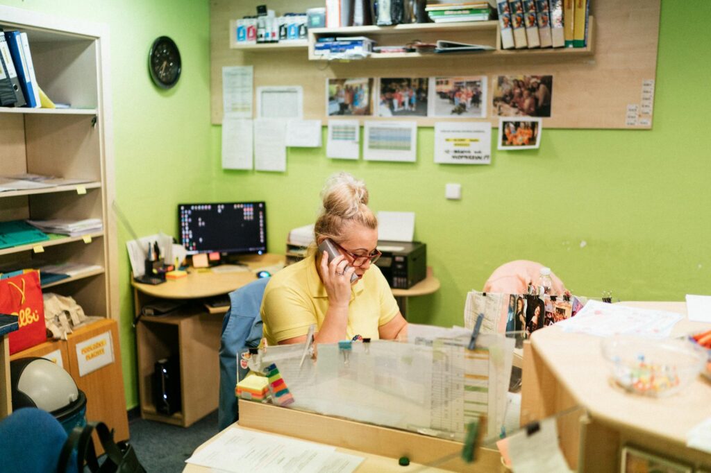 A volunteer making phone calls in a campaign office, engaging with voters. — support Paul For Nevada