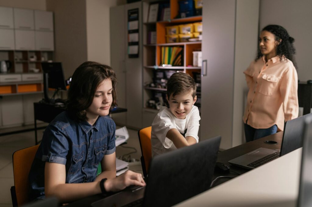 Students using technology in a modern classroom environment — Paul For Nevada education policy