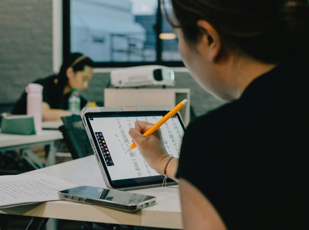 Students using technology in a modern classroom setting in Nevada. — Paul For Nevada education reform