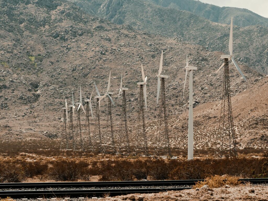 Wind turbines generating energy on a Nevada hillside — Paul For Nevada renewable energy