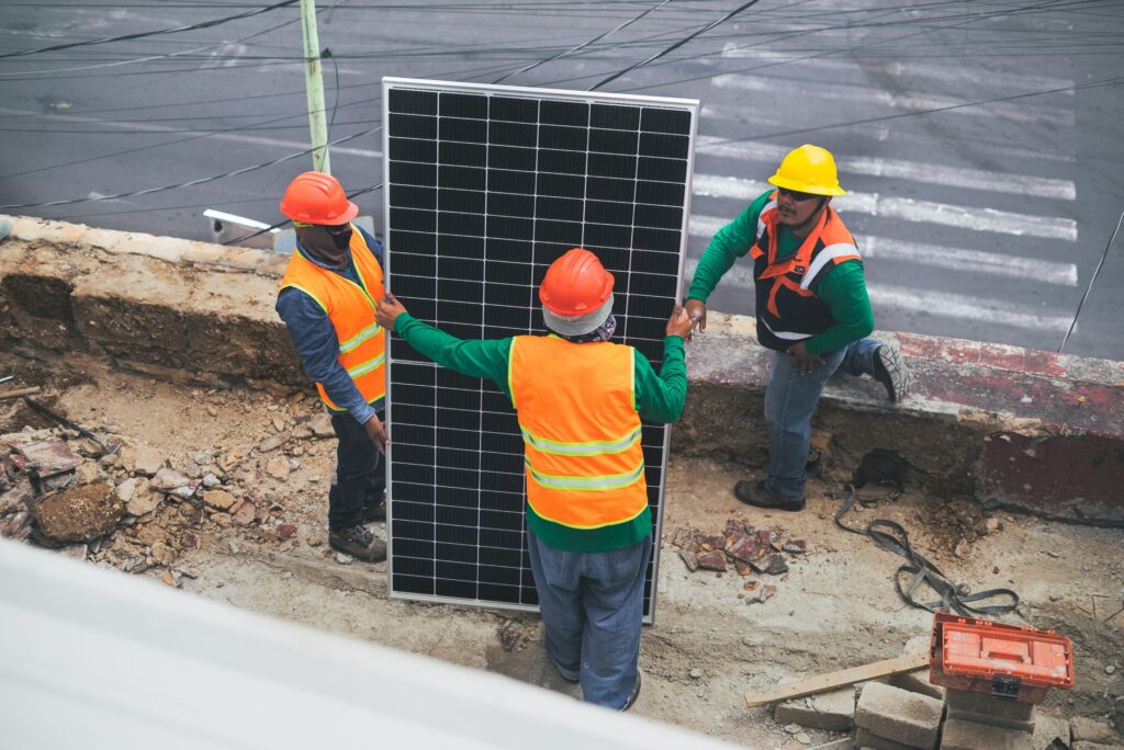 A construction site for renewable energy infrastructure with workers in safety gear. — energy infrastructure jobs