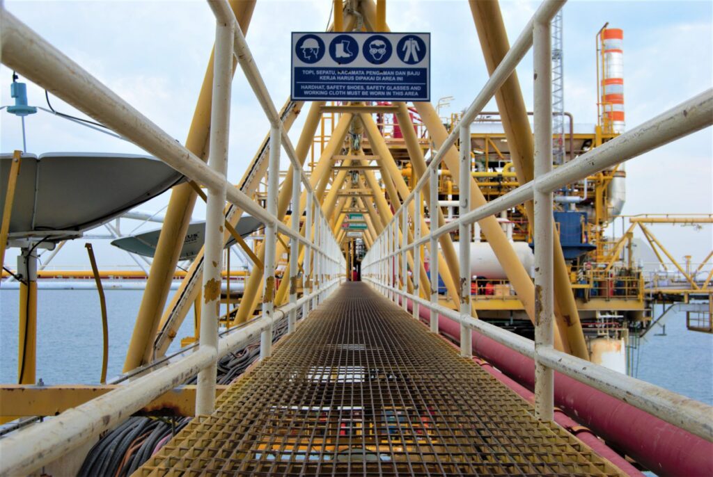 A modern oil rig showing advancements in technology and production methods. — modern oil production environment