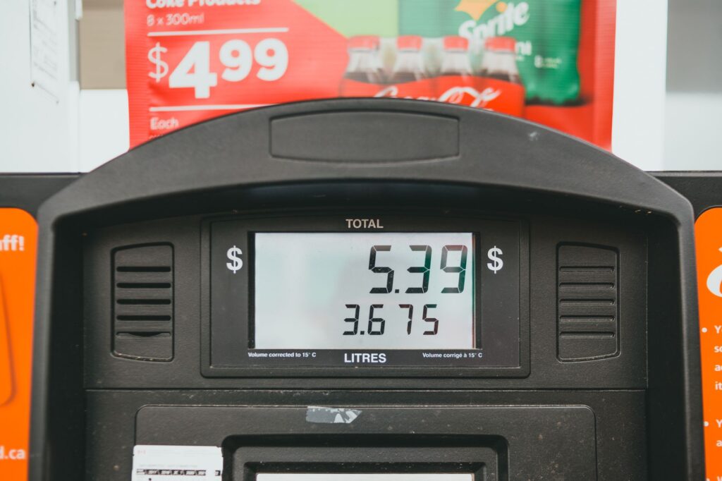 A photo of a gas station in Nevada with current fuel prices displayed, highlighting the impact of fuel prices and geopolitics on local economies.
