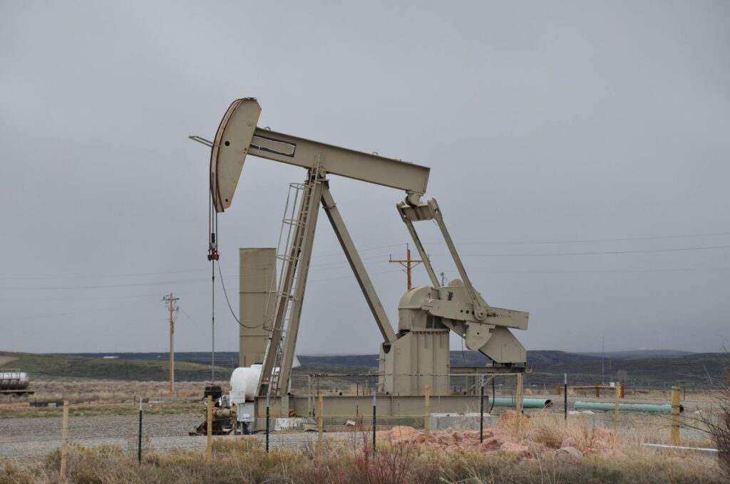 A photo of oil rigs operating in the Nevada landscape, showcasing the challenges and opportunities within the nevada oil and gas industry.