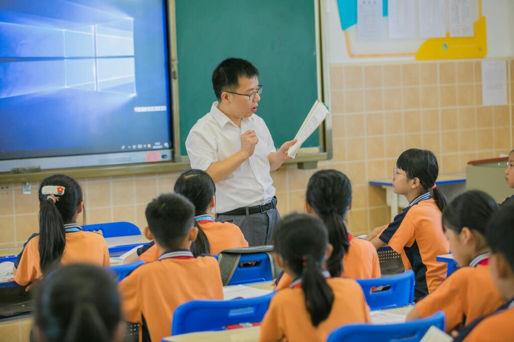 A picture of a teacher conducting a training session related to Paul For Nevada education reforms.
