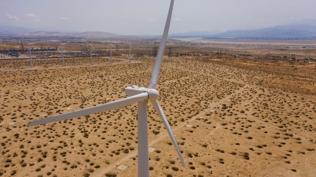 An aerial view of wind turbines contributing to Nevada's renewable energy. — natural gas vs renewable energy