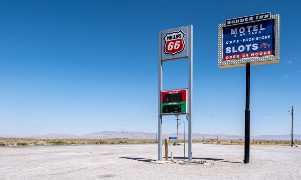 An image of a gas station in Nevada with current price signage. — nevada gas prices