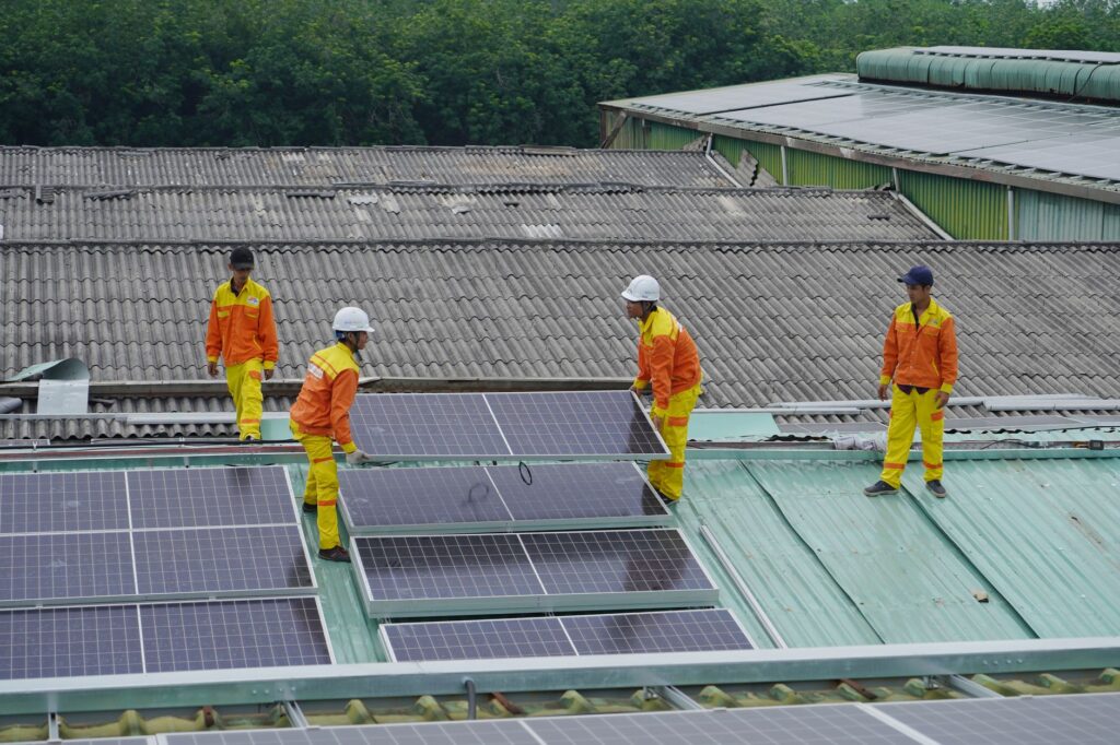 Community members participating in a solar panel installation — Paul For Nevada renewable energy