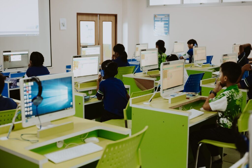 Illustration of technology being used in a modern classroom — Paul For Nevada education plans