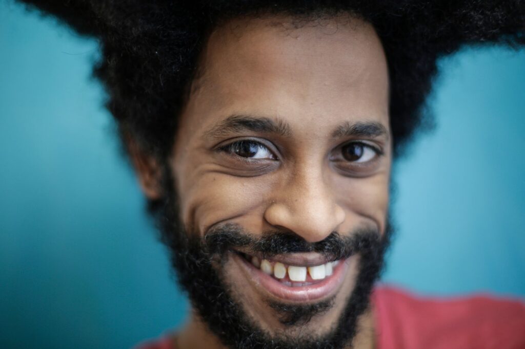 Portrait of Paul smiling confidently, symbolizing his approachability and charisma. — Paul For Nevada biography