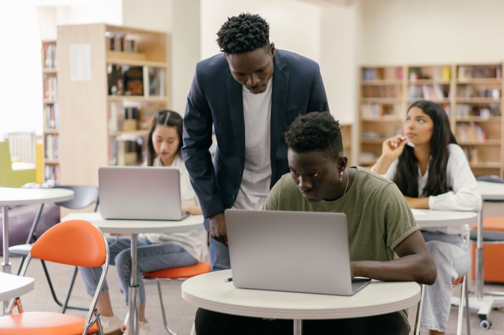 Students engaged in collaborative learning activities in a modern classroom. — Paul For Nevada education reform