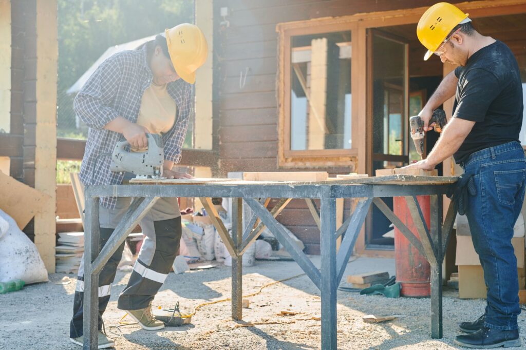 Workers in a skilled trades role, such as electrical or plumbing, on an energy project. — energy infrastructure jobs