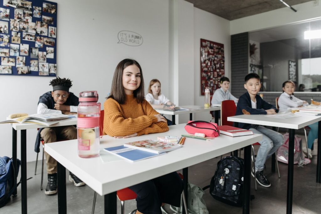 A smiling classroom filled with diverse students engaged in learning activities, representing Nevada education improvement…