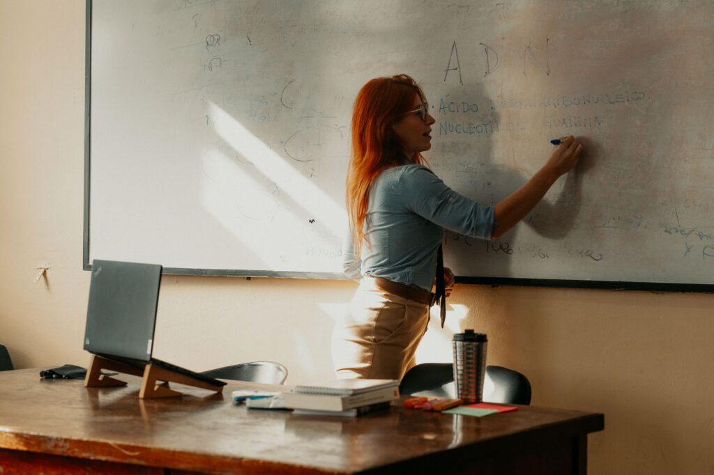 A teacher conducting a training session, representing investment in teacher resources. — Paul For Nevada education reform