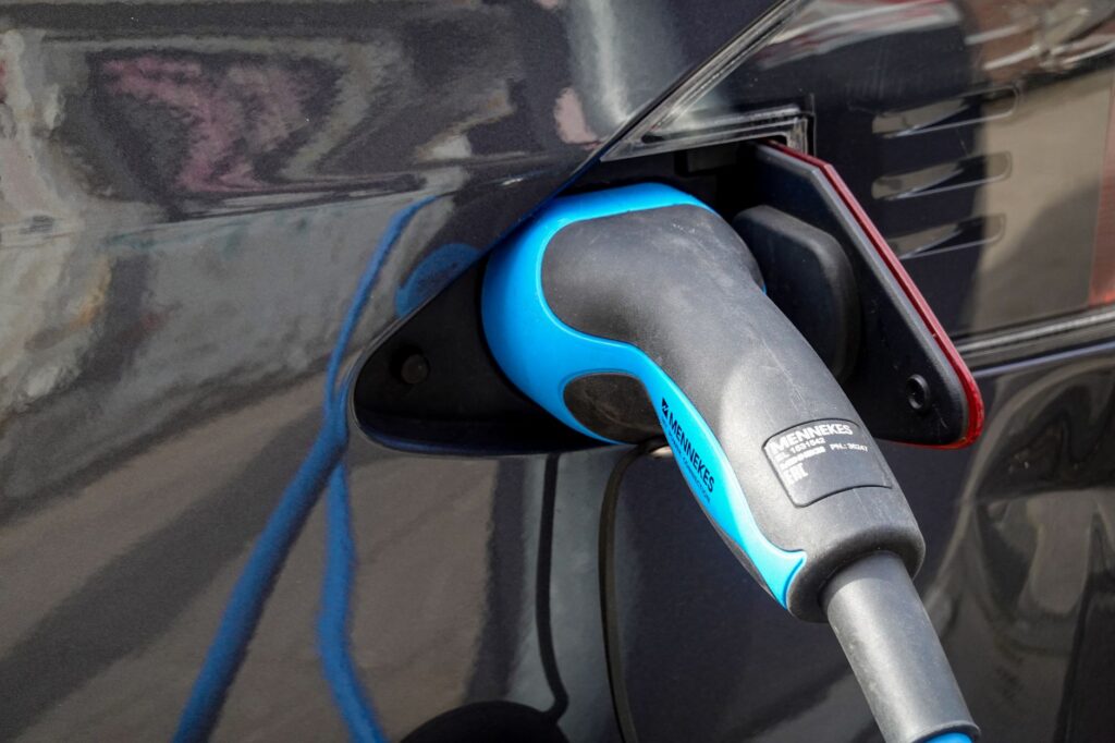 A visual representation of electric vehicles in contrast to traditional fuel-powered cars. — future of fossil fuels
