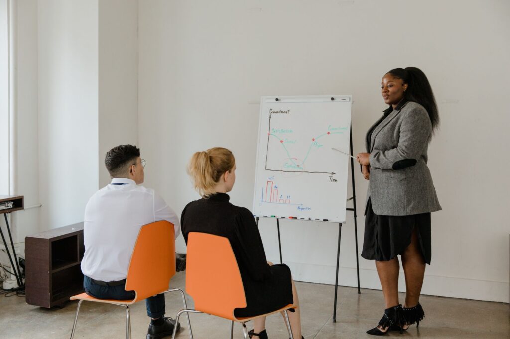 An image of small business owners discussing growth strategies in a workshop setting. — Paul For Nevada economic plans