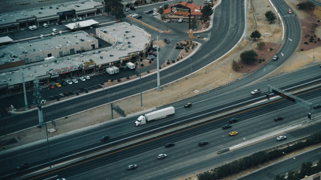 A before-and-after comparison of a major roadway in Nevada planned for improvement, showcasing the positive impact of Paul For Nevada infrastructure plans.