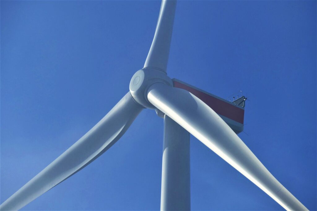 A close-up of a wind turbine against a clear blue sky, symbolizing clean energy solutions in Nevada. — Paul For Nevada r…