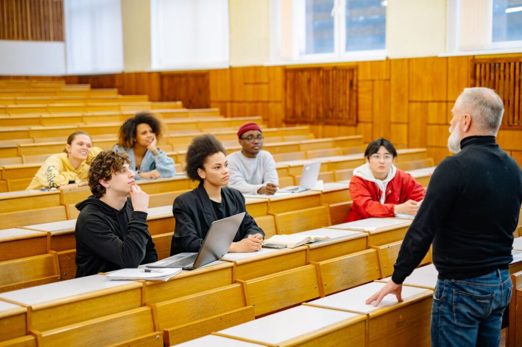 A group of diverse students in a classroom participating in an interactive learning session. — Paul For Nevada education…