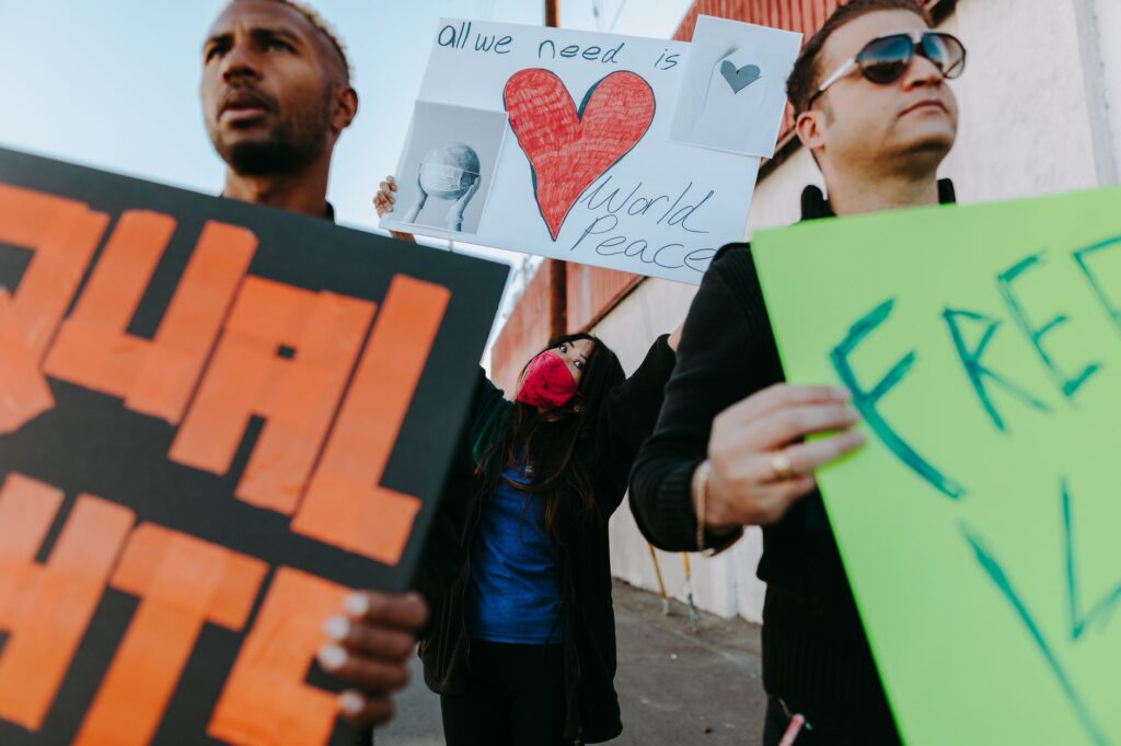 A group of diverse supporters holding signs for Paul For Nevada at a campaign event. — Paul For Nevada policies