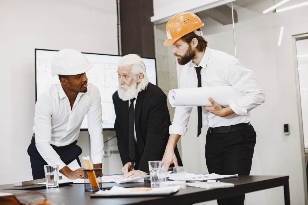 An image of community members participating in a local meeting about infrastructure planning, discussing the Paul For Nevada infrastructure plans