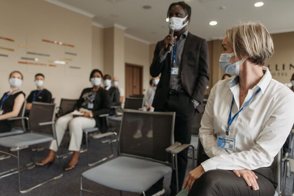 An image of residents discussing healthcare options at a town hall meeting — Paul For Nevada healthcare proposals