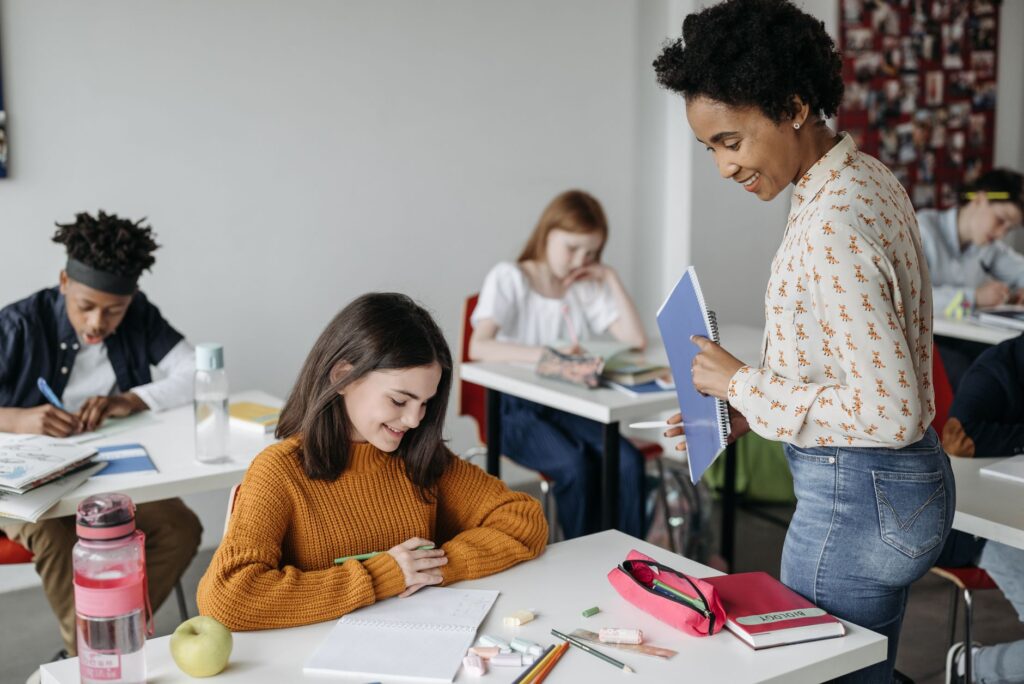 Classroom setting with engaged students and a supportive teacher. — Paul For Nevada education reforms
