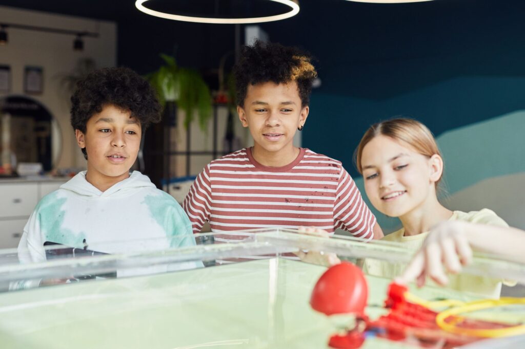 Photo of a classroom with diverse students engaged in STEM activities. — Paul For Nevada education plans